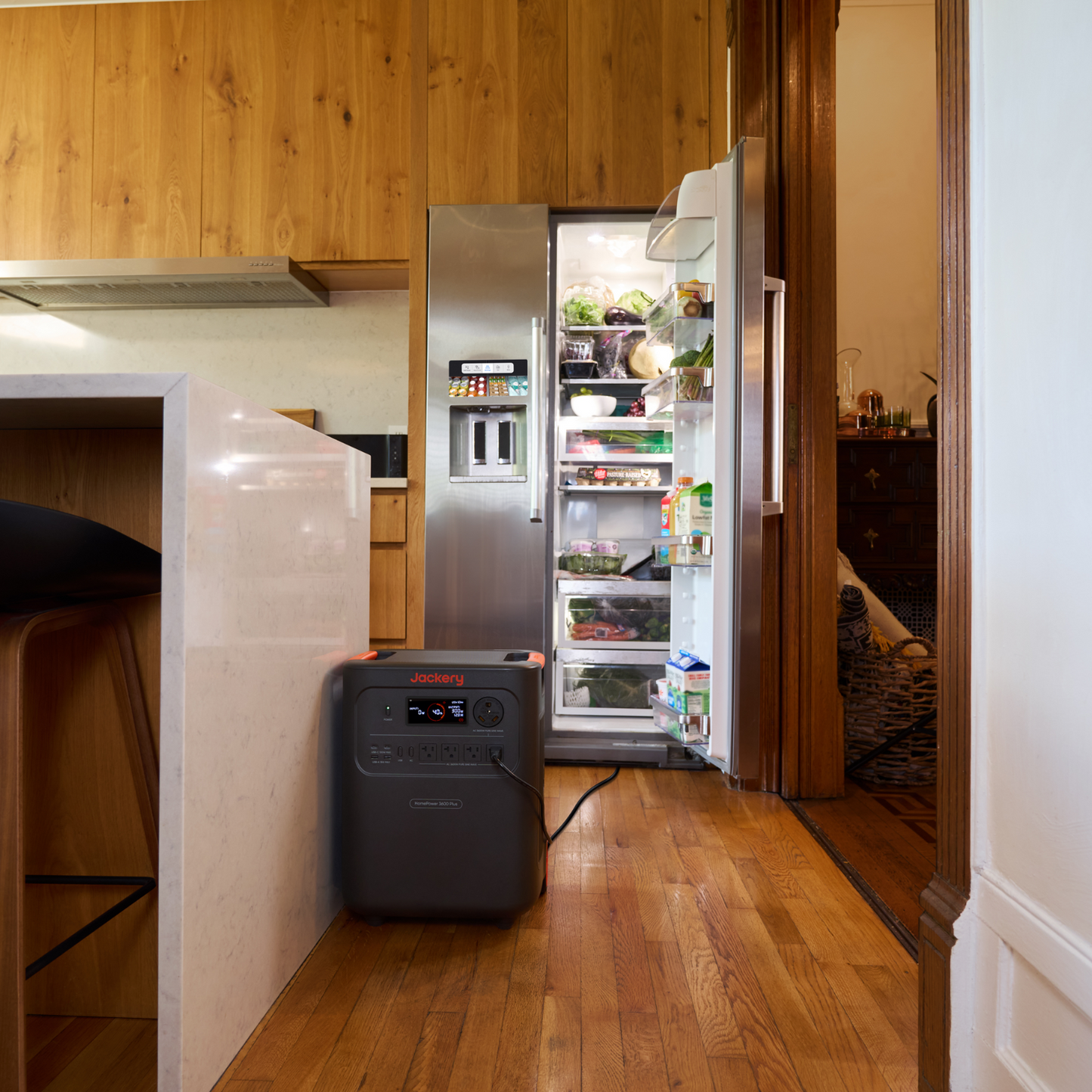 Jackery HomePower 3600 Plus Portable Power Station in a kitchen with an open refrigerator